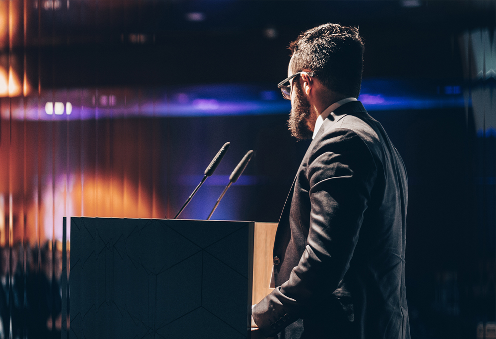 Business professional speaking at conference